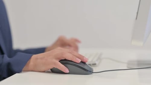 Close up of Female Hand Using Computer Mouse