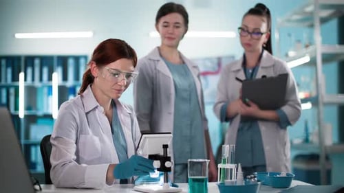 Women Scientists Work in Bright Laboratory Setting