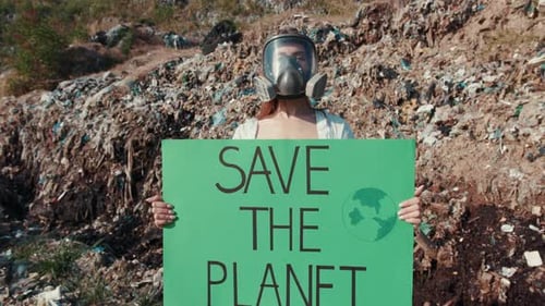 Woman in Gas Mask Holding Save the Planet Sign