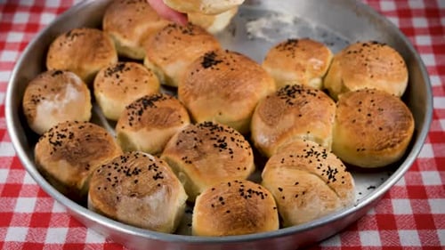 Golden Baked Buns with Seeds on Tray