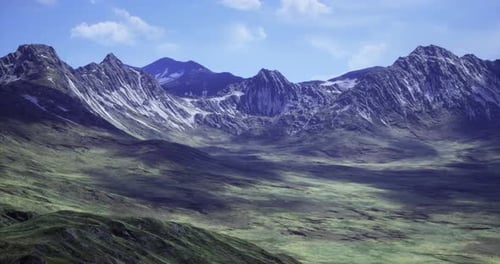 Majestic Mountain Landscape with Lush Valleys Under a Clear Blue Sky