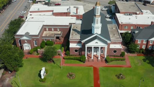 Aerial View of Red Brick Church in Urban Setting