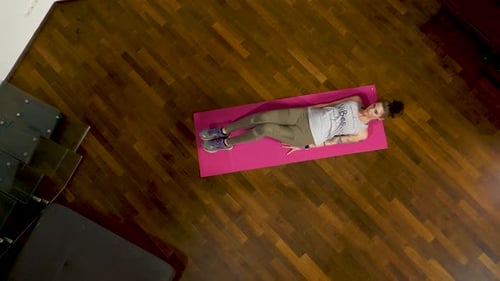 Woman Doing Abdominal Exercises on Yoga Mat