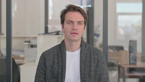 Portrait of Tense Casual Young Man in Denial