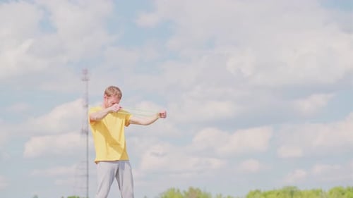 Man Exercising Outdoors with Resistance Band