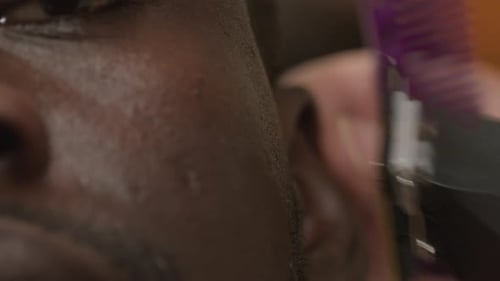 Man Gets Detailed Haircut with Clippers Close Up