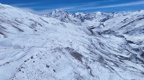 Snowy Mountain Range Aerial View in Winter
