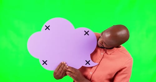 Speech bubble, pointing and a black man on green screen in studio for social media marketing