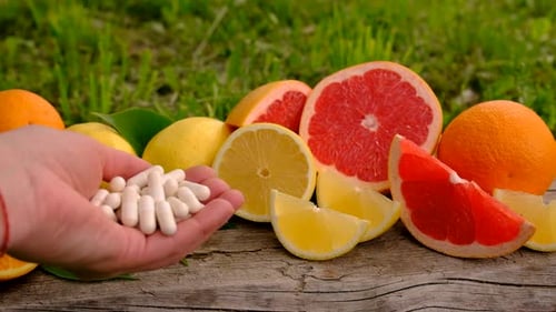 Citrus Fruits and Vitamin Supplement Capsules