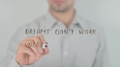 Man Writes Motivational Message on Transparent Surface