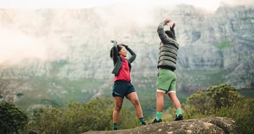 Celebration, mountain and couple with hike in nature for bonding, exercise or adventure together