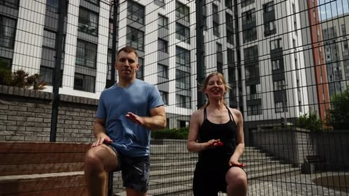 A Man and a Woman are Training on a Sports Basketball Court Outdoor Sports