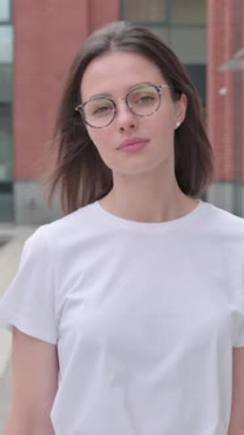 Close up of Young Woman Walking on Street, Slow Motion, vertical video