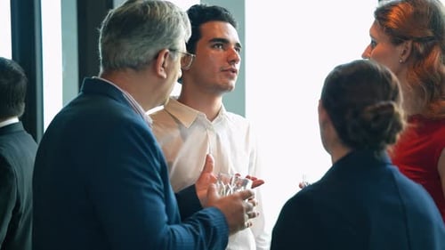 Businessman enjoy discussing with business partner at corporate networking event or office New year
