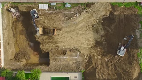 Aerial of Excavators Digging Soil for Construction Project