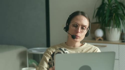 Professional Woman Working at Home on Laptop
