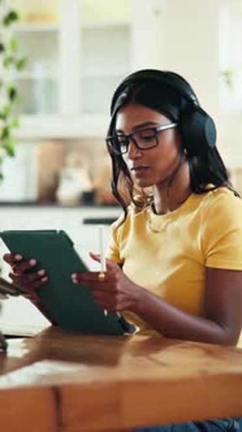 Headphones, tablet and writing with graphic design student in home for education or learning