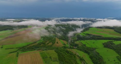Low Clouds Covering Part of the Landscape Heavy Clouds Green Vegetation Mist Fog and White Clouds in