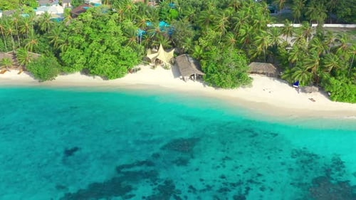 Aerial Top View on White Sand Beach with Thatched Huts and Lush Tropical Island Bora Bora French