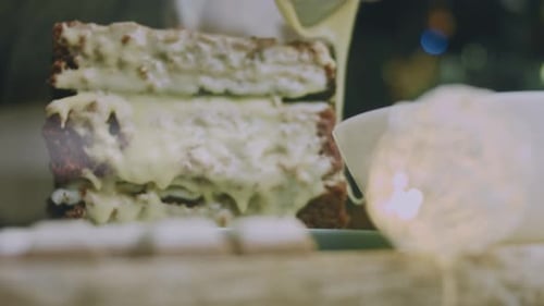 I Spread the Cream on the Square Cake Crusts Christmas Atmosphere with Lights in the Background