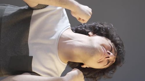 Vertical video of Depressed young man shouting, rebelling.