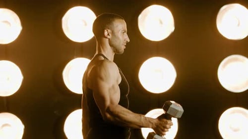 Man Weightlifting Dumbbell Bicep Curls with Lights