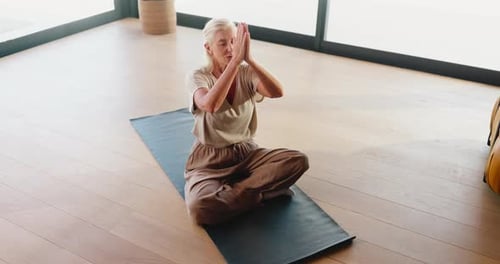 Above, meditation and yoga with mature woman in studio for balance, mental health or wellness