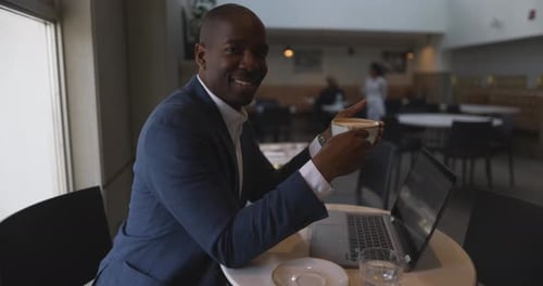 Portrait Smiling Businessman Drinking Cappuccino in Cafe 4044 Years