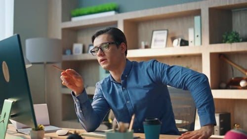 Confident businessman gesturing hand having virtual video call at modern office