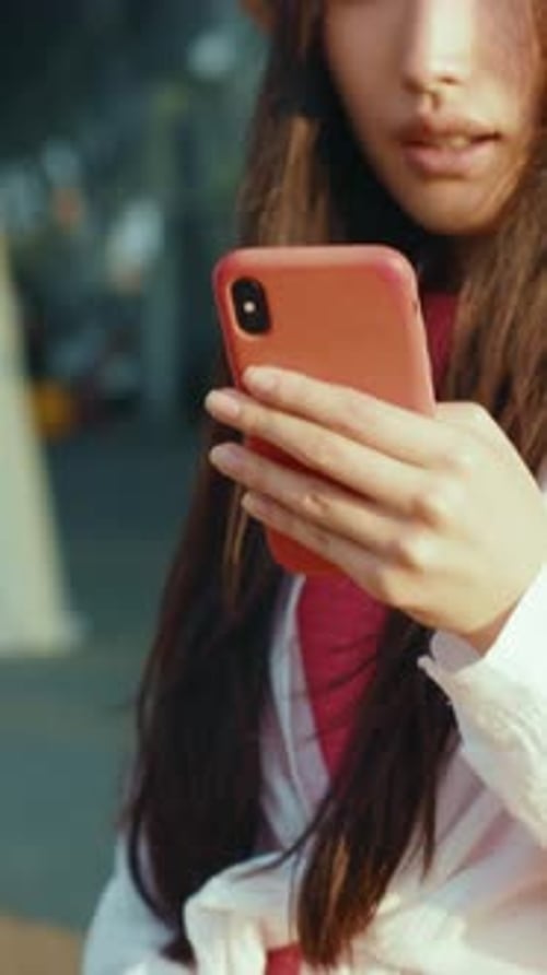 Stylish Woman Using Mobile Phone Outdoors