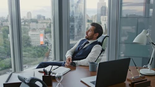 Disappointed Manager Reading Message on Smartphone Sitting in Luxury Office