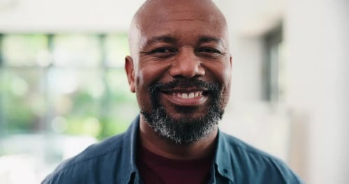 Face, homeowner and black man in lounge, smile and confidence with property investment