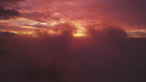 Aerial View of Mountains and Clouds at Sunset