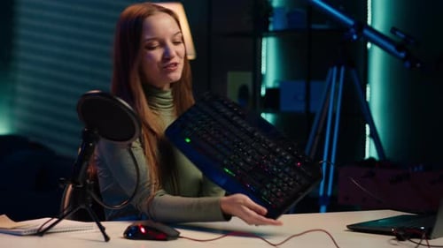 Enthusiastic Woman Showcasing Computer Keyboard and Mouse