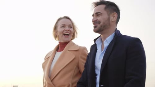 Stylish Couple Walking and Talking Outdoors