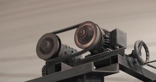 Rotating Parts With Gears Of Industrial Equipment At Factory. - Close Up