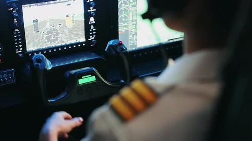 Female Pilot Siting in Cabin of Airplane