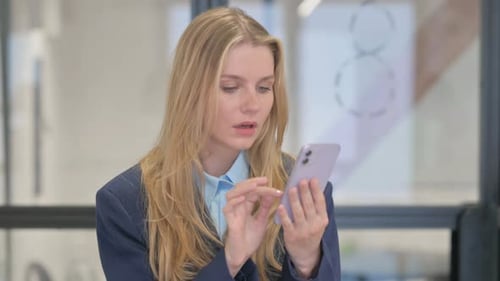 Worried Woman Reacting Negatively to Smartphone News