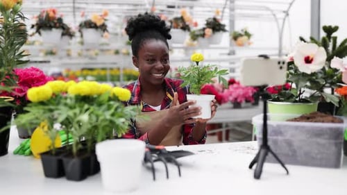 Woman Filming a Plant Tutorial