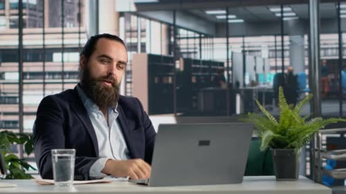 Man Talking During a Video Conference in Office
