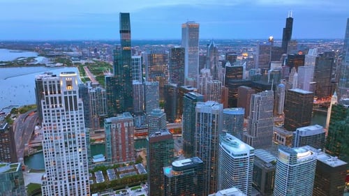Chicago scenic view in the twilight. Grand skyscrapers full of lights. Metropolis panorama