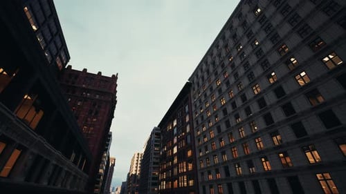 Economic District During Sunset with Glowing Structures and Busy Evening Activity