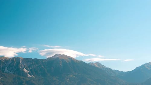 Serene Morning Vista of Lake Bled with Majestic Mountain and Cloud Views