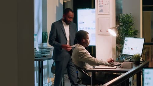 Two Men Working in Corporate Office Environment