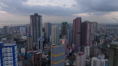 Aerial Ascending Footage of Modern High Rise Residential Buildings in Urban Borough Panoramic View