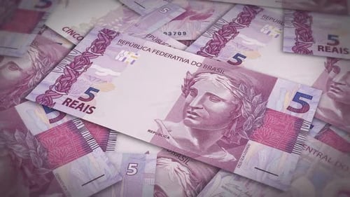 Pile of brazil real cash money, inflation concept. Closeup new brazil five real bills