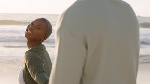 Happy, beach and couple love ocean walking together in summer and relaxing in peaceful nature