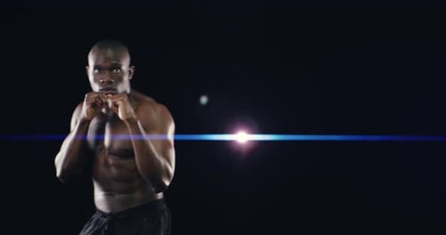 4k video footage of an athletic young man against a black background