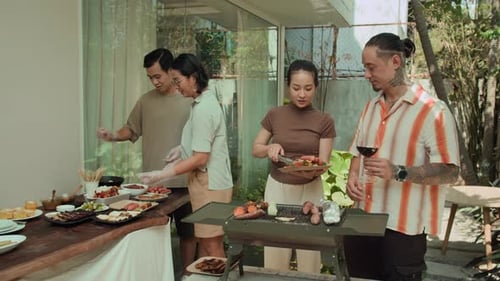 Friends Enjoying Outdoor Grill and Food at Home
