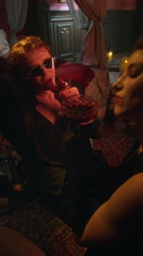 Two Vampire Lovers Sharing Dark Red Blood and Smiling Intimately